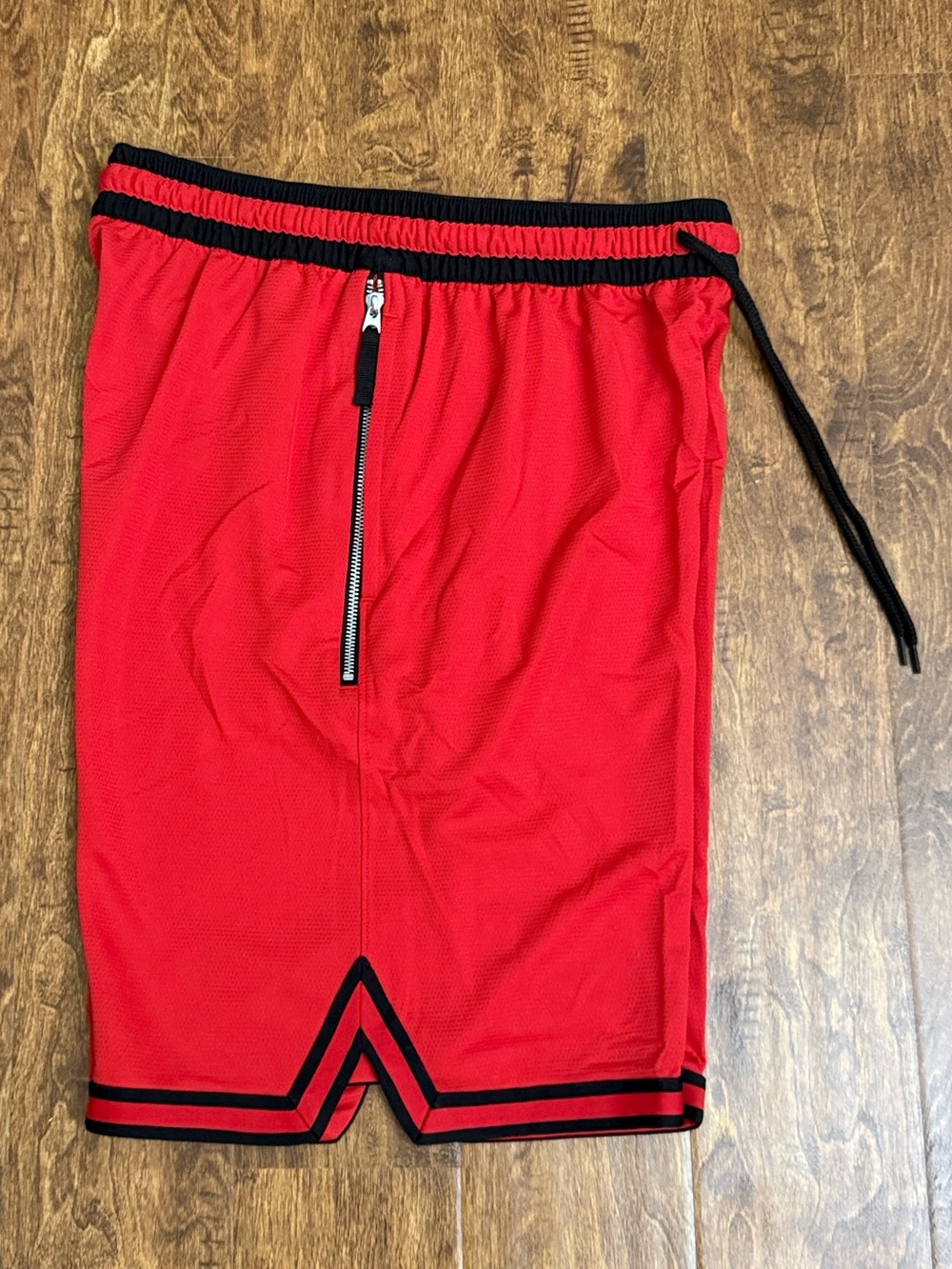 Nike Red Athletic Shorts with Black Trim and Drawstring